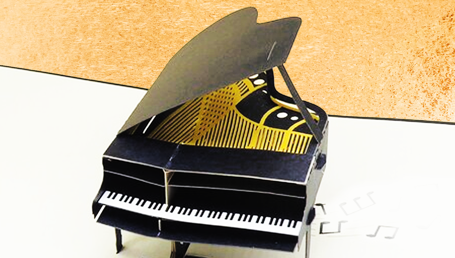 visuel d'un piano en carton façon carte depliante